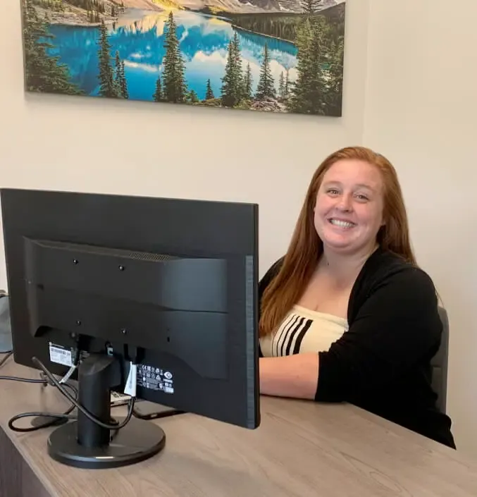 A member of the Anderson Air office team at the front desk