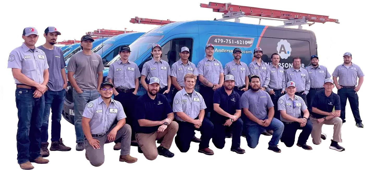The Anderson Air team in uniform in front of the service vans